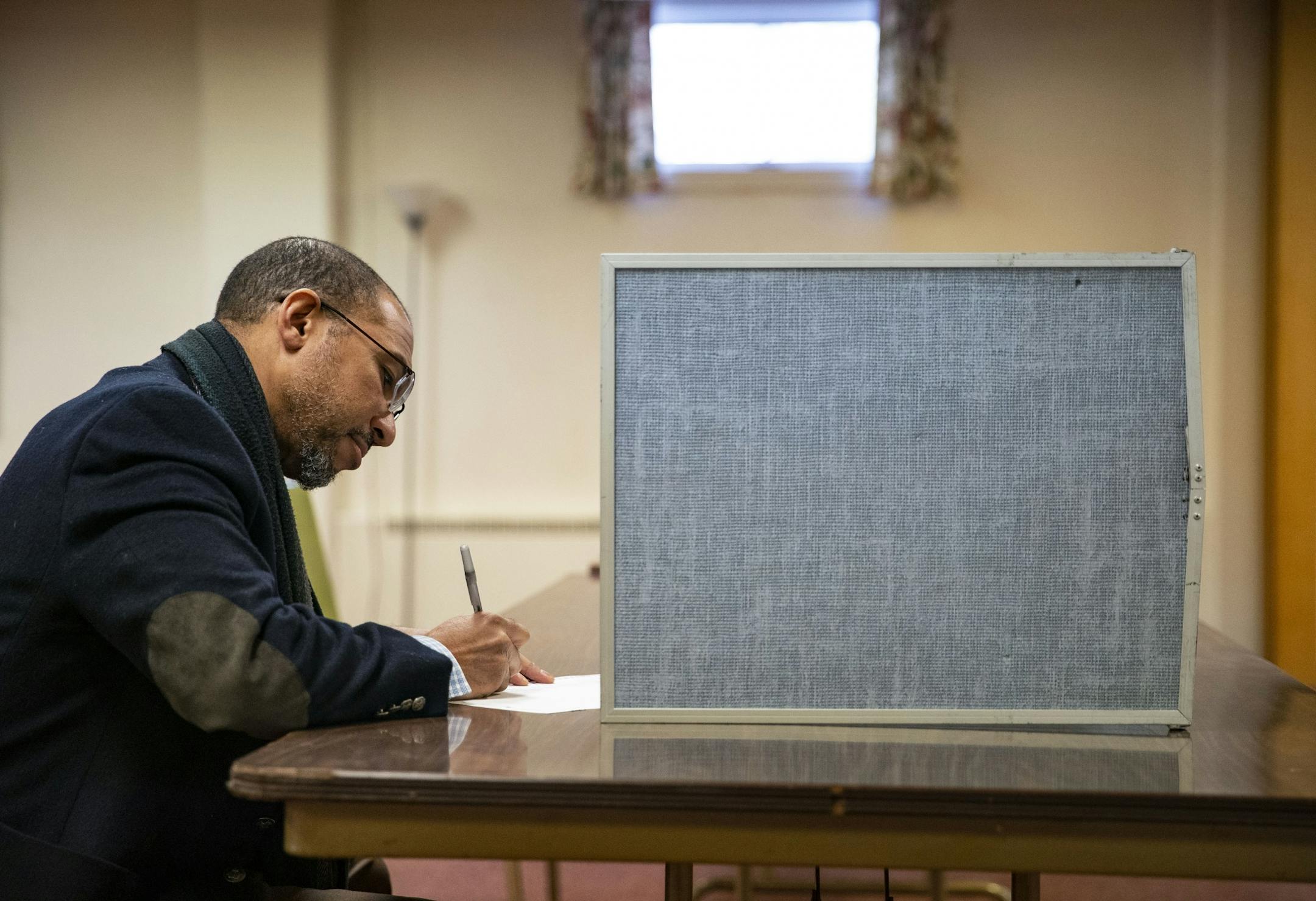 Shawn Pearson filled out his ballot at Duluth Congregational Church in Duluth's 8th precinct on Tuesday.