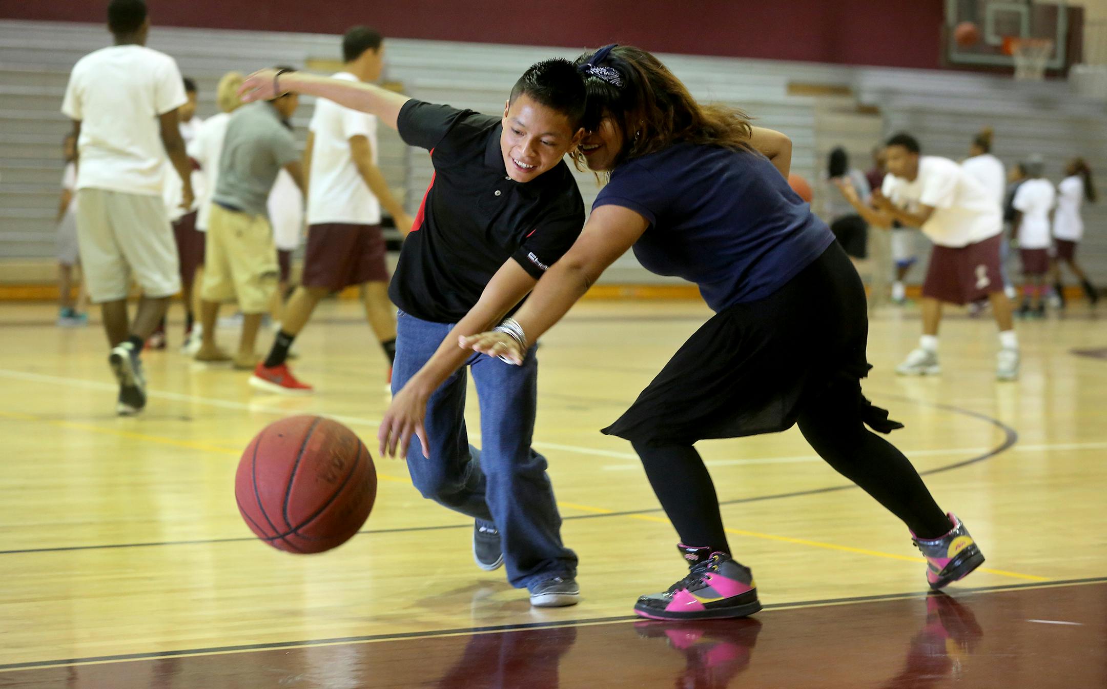 Hugo Pascual Tomas plays basketball during P.E. at Lake Worth Community High School. (Mike Stocker/Sun Sentinel/TNS)