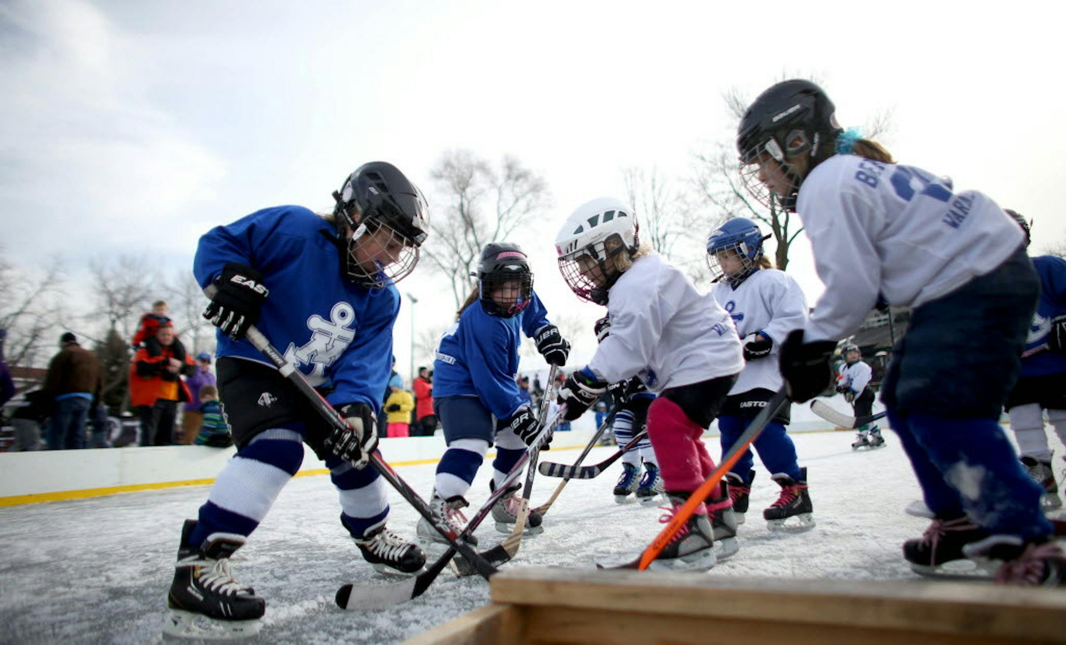 Minnetonka U6 girls went after the puck at the North American Pond Hockey Championship in Excelsior in January 2015.