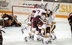t092717 --- Clint Austin --- 100717.S.DNT.UMDPUX.C13 --- Minnesota Duluth players react after Parker Mackay scored the game winning goal in overtime a
