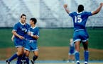 Manuel Lagos is congratulated by a Minnesota Thunder teammate after scoring in a 1993 game at the National Sports Center in Blaine. At the time, the T