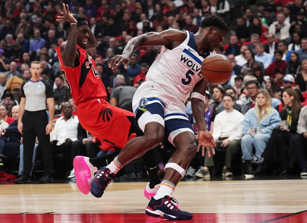 The Timberwolves’ Anthony Edwards, right, battled the Raptors’ Pascal Siakam on Wednesday night. Edwards tied a career high with 14 rebounds in th