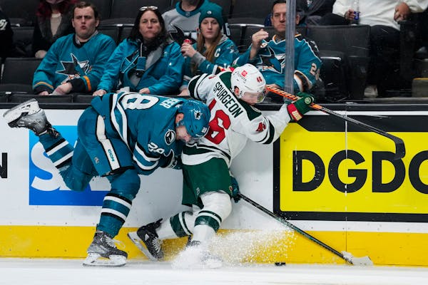 San Jose Sharks right wing Timo Meier, left, and Minnesota Wild defenseman Jared Spurgeon collide during the second period of an NHL hockey game in Sa