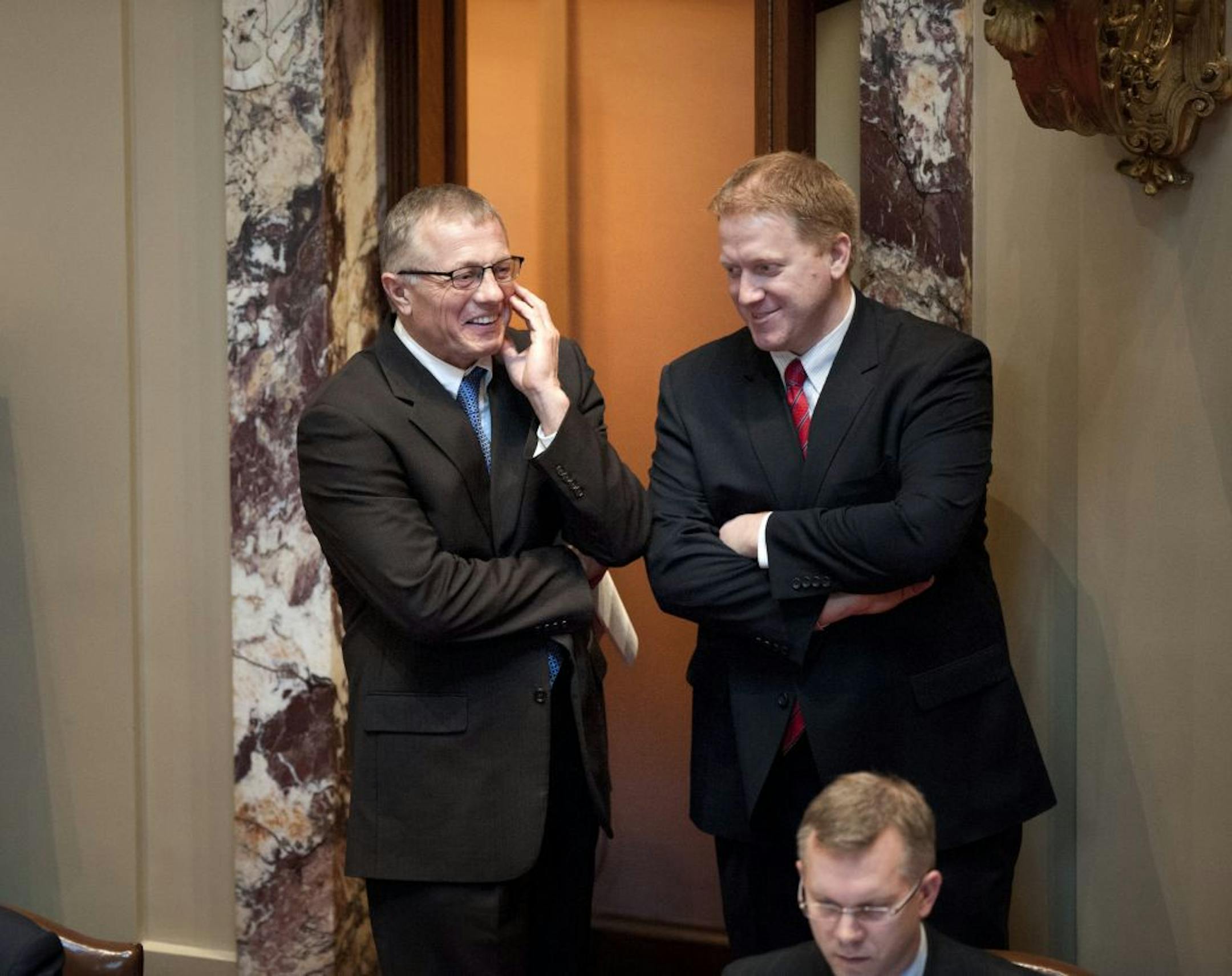 GOP Senate caucus communications director Steve Sviggum talked with his boss Senate GOP caucus chief of staff Kevin Matzek in the back of the Senate floor Monday, February 27, 2012 while the teacher tenure bill was being debated. Sviggum has come under fire for taking the GOP job and being a member of the University of Minnesota Board of Regents.
