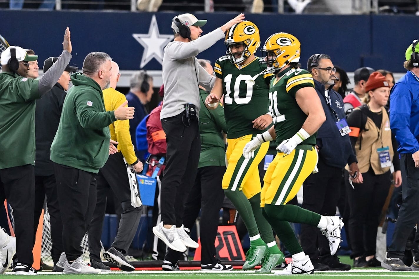 Green Bay Packers head coach Matt LaFleur congratulates quarterback Jordan Love (10) during the second half against the Dallas Cowboys of an NFL wild-card playoff football game Sunday, Jan 14, 2024, Texas, in Arlington. (AP Photo/Maria Lysaker)