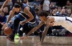 Derrick Rose and Kelly Oubre Jr. fought for a loose ball in the second quarter. ] CARLOS GONZALEZ &#x2022; cgonzalez@startribune.com &#x2013; January 