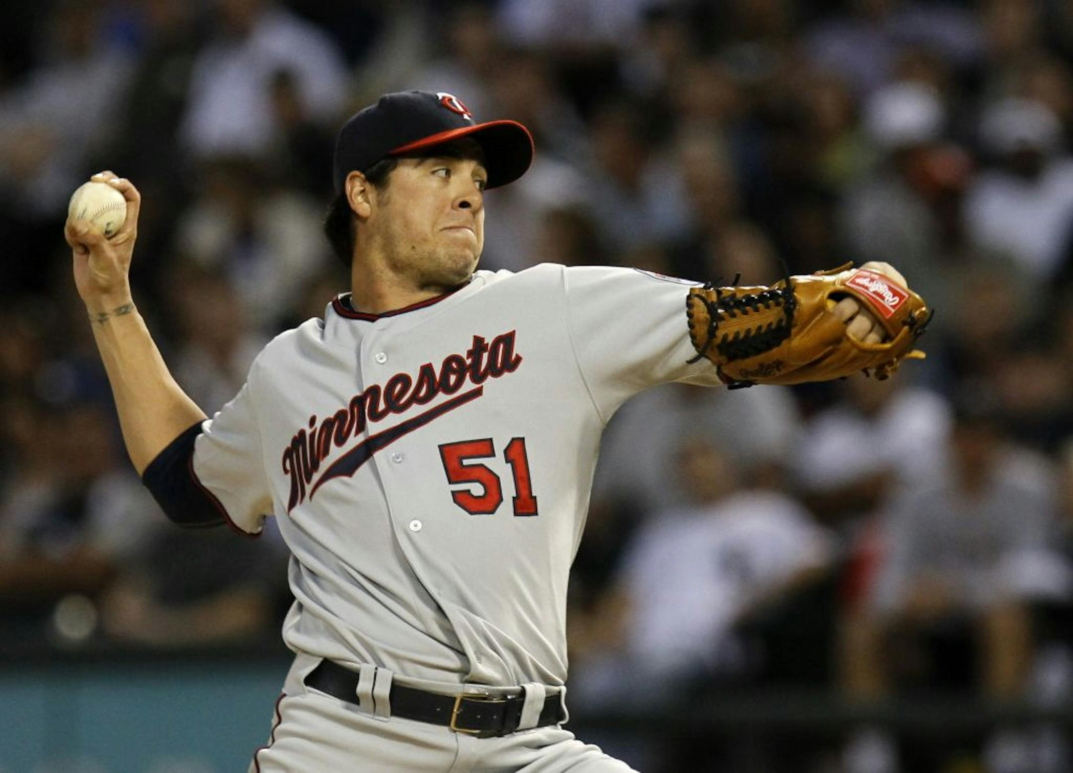 Minnesota Twins starting pitcher Anthony Swarzak delivers during the first inning of a baseball game against the Chicago White Sox Tuesday, Aug. 30, 2011 in Chicago.