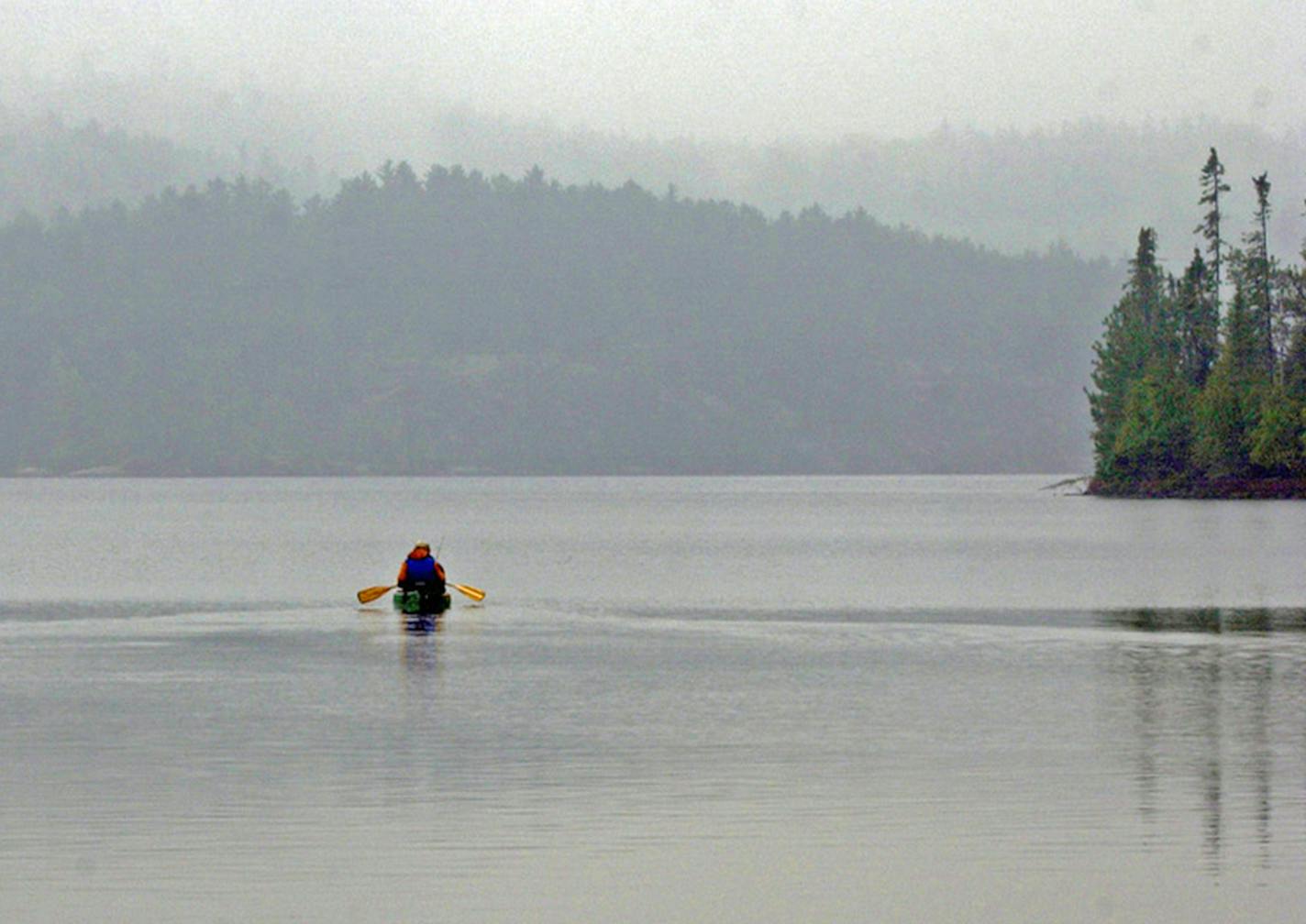 Even on rainy, misty days, paddling in Quetico Provincial Park, Ontario, provides an excellent summer getaway for Minnesota anglers and canoeists. If the border remains closed, the park will be off-limits to Minnesotans this summer. ORG XMIT: MERe3acf87ba49908f4ec7cada284df3