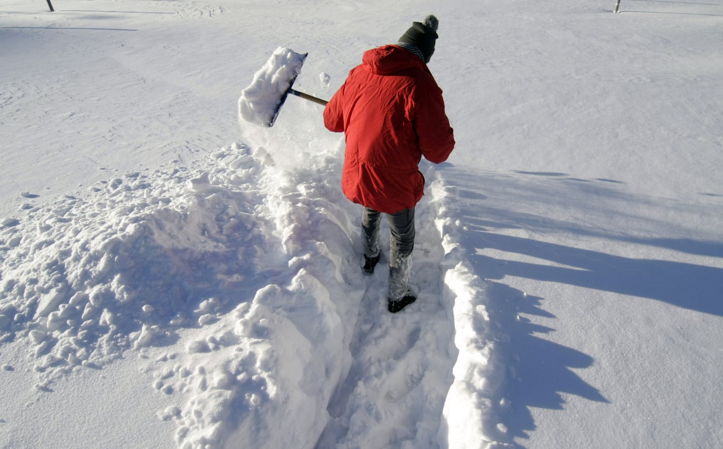 credit as photo illustration - photo tom sweeney - photo illustration London Nelson accompanies Kim Ode snow shoveling eaasy