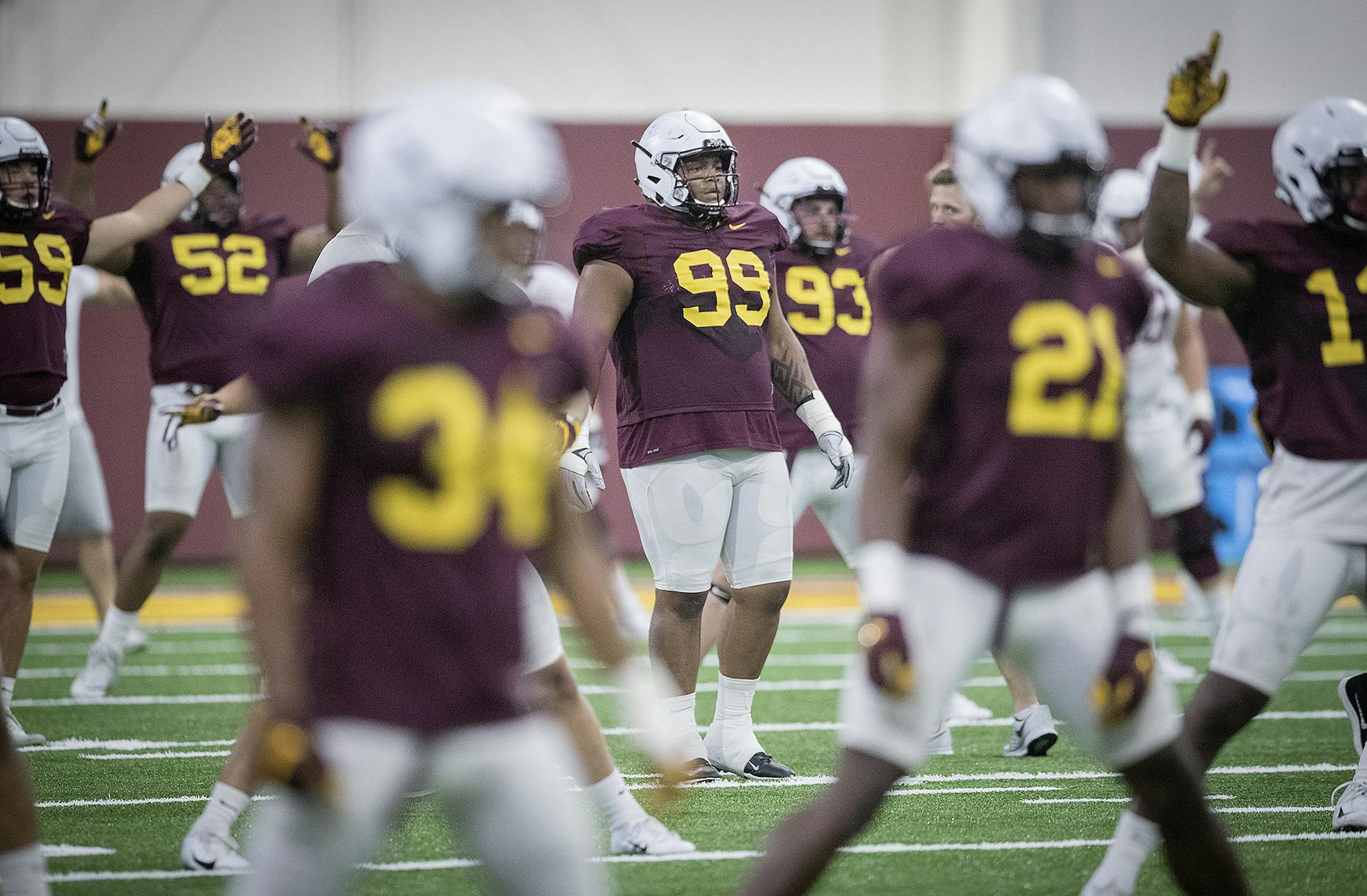 Minnesota's defensive line O.J. Smith, center, took to the field for the first practice that was open to the public at the Athletes Village at the University of Minnesota in Minneapolis, MN.