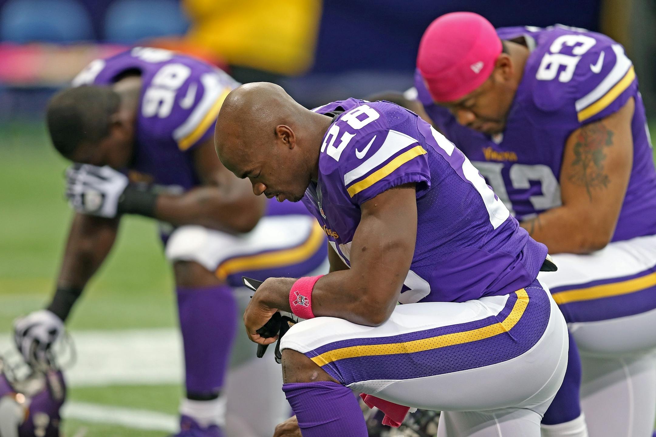 Vikings running back Adrian Peterson (28) knelt in prayer before Sunday's game against the Carolina Panthers at Mall of America Field.