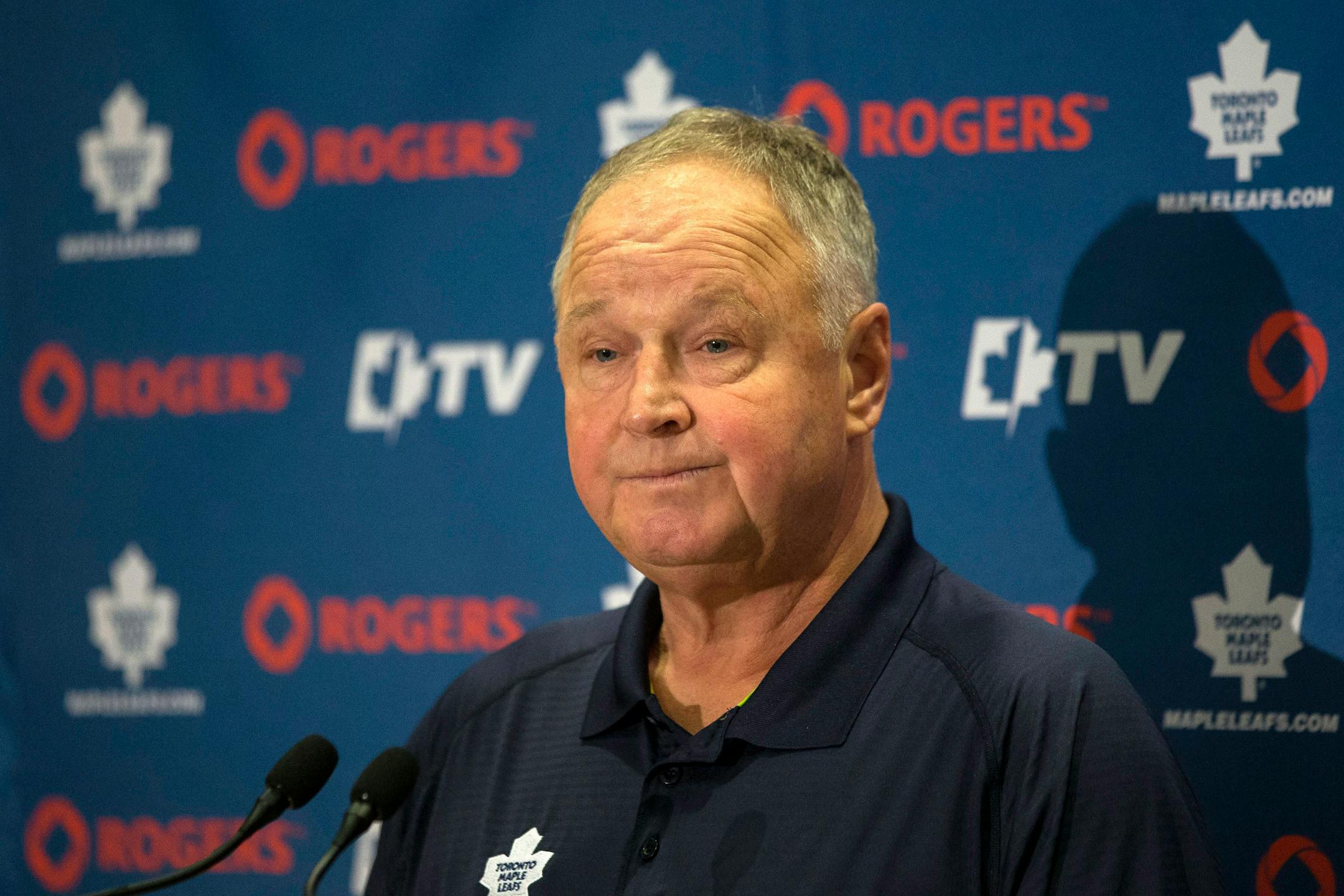 Toronto Maple Leafs head coach Randy Carlyle speaks with reporters during NHL hockey training camp in Toronto, Thursday, Sept. 18, 2013. (AP Photo/The Canadian Press, Chris Young)