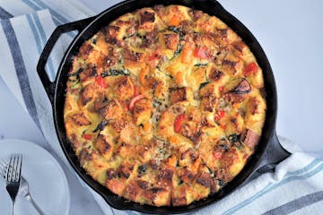 Italian sausage and sautéed vegetables make strata into an anytime meal.