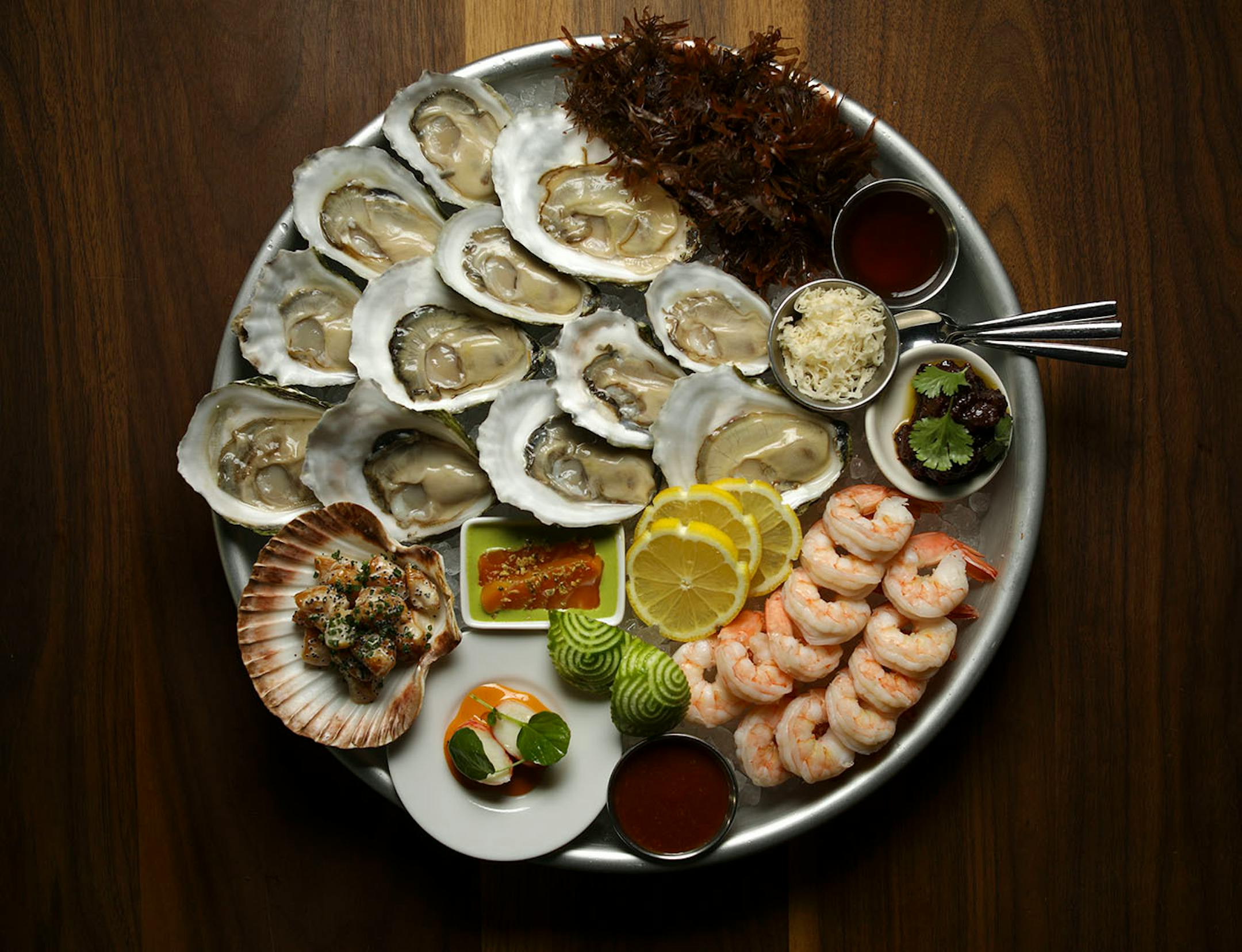 The chilled seafood platter, with oysters, shrimp cocktail, tuna tiradito, smoked bay scallops, crab with carrot mayo, crudo & accompaniments, as prepared at Martina Wednesday evening.