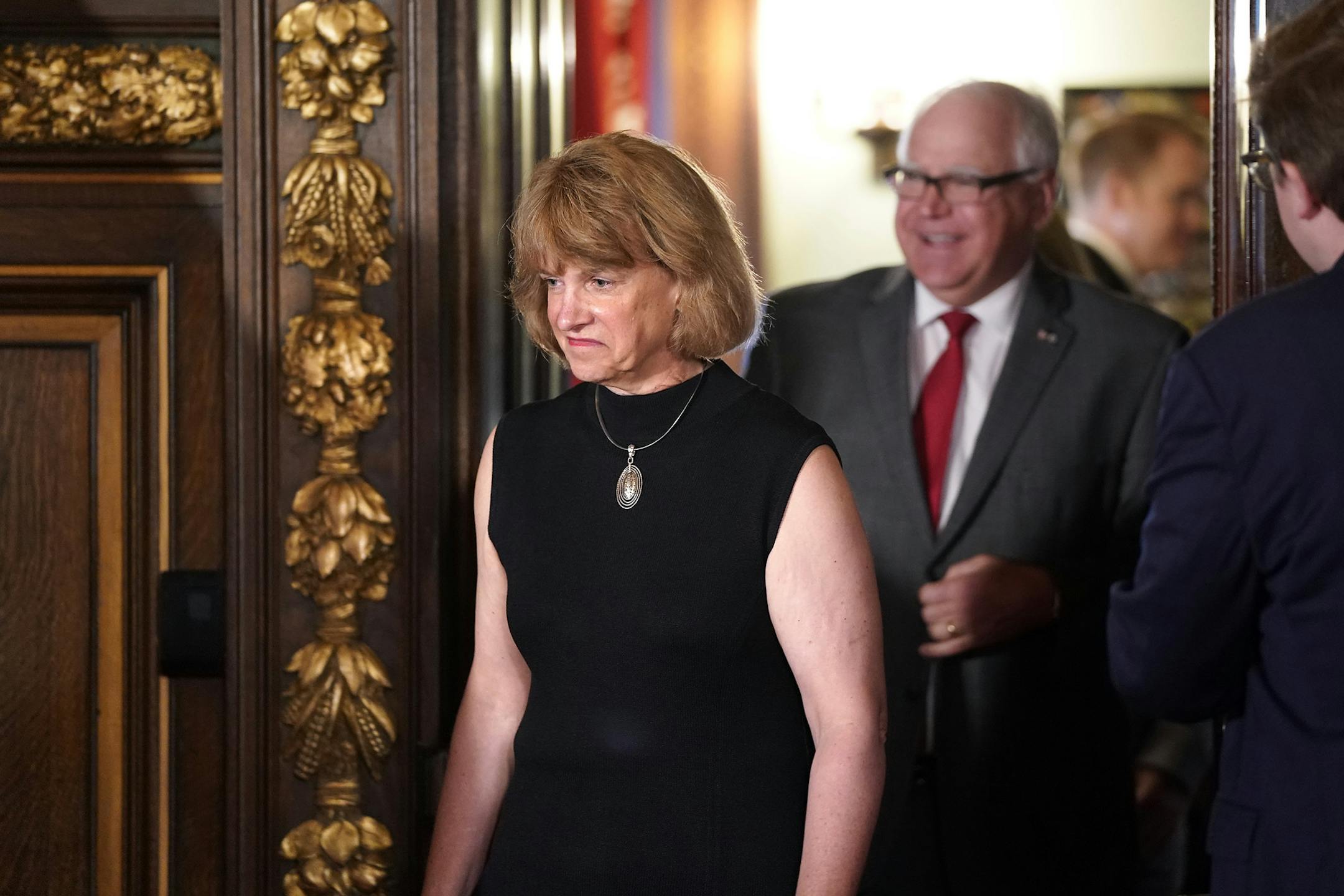 FILE - In this Aug. 12, 2019 file photo, Jodi Harpstead walks into a press conference ahead of her announcement as new Commissioner of the Department of Human Services, at the Capitol in St. Paul, Minn. Harpstead, the chief executive of Lutheran Social Service of Minnesota, takes over as commissioner Sept. 3. Walz appointed her, turning to an executive with experience managing large organizations. (Leila Navidi/Star Tribune via AP,File)