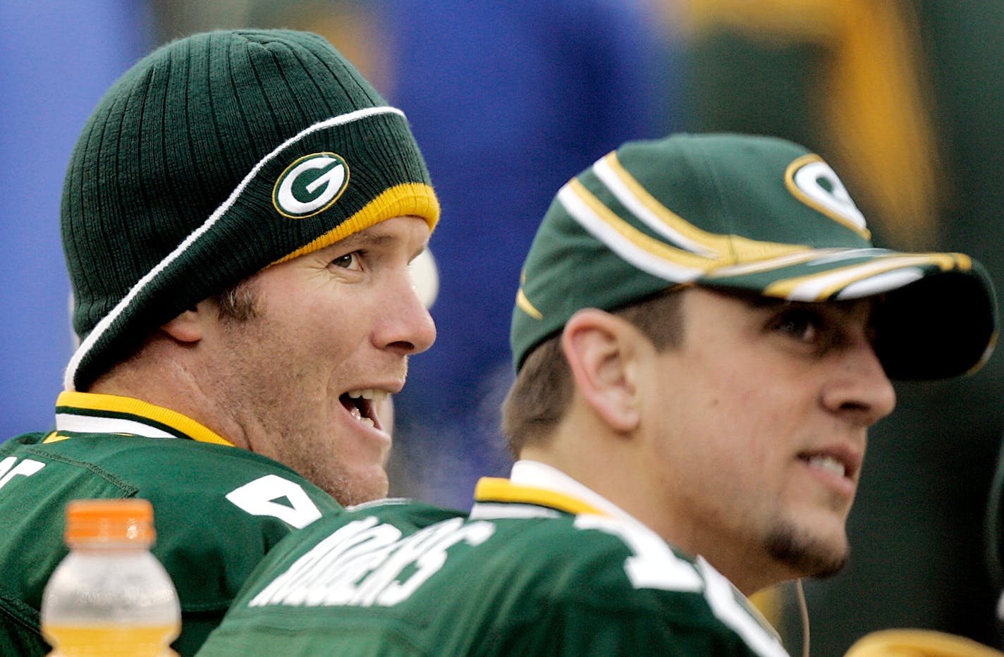 FILE - In this Jan. 1, 2006, file photo, Green Bay Packers quarterback Brett Favre, left, and back-up Aaron Rogers share time on the bench during their NFL football game against the Seattle Seahawks in Green Bay, Wis. Former quarterback Favre says Rodgers was surprised by Green Bay's decision to draft a quarterback in the first round. Favre said Wednesday, April 29, 2020, on "The Rich Eisen Show" that he had spoken with Rodgers since the Packers traded up four spots in the first round to take Utah State's Jordan Love with the 26th overall pick in the draft Thursday. (AP Photo/Morry Gash, File)