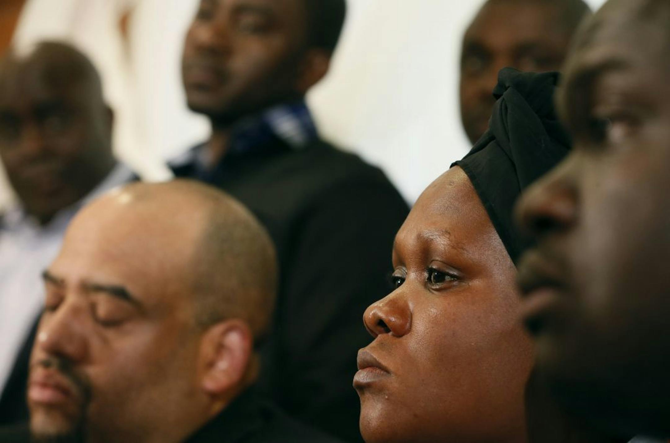 Supporters flanked Louise Karlua the mother of Barway Collins as she spoke the media at the OLM office Thursday April 30, 2015 in Brooklyn Park, MN. Jerry Holt/ Jerry.Holt@Startribune.com