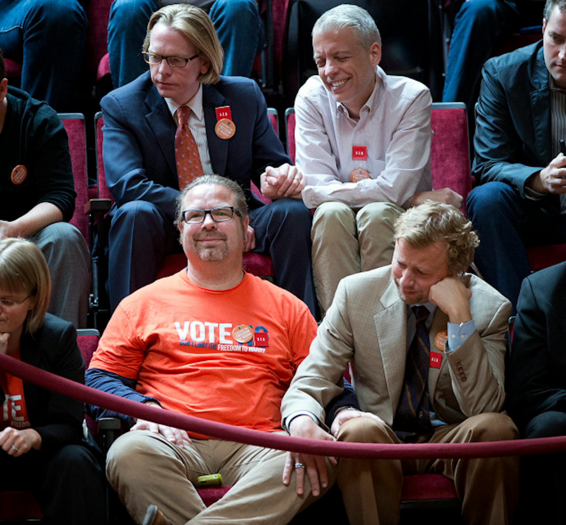 On the top row Lee Anderson and William Fehrenbach held hands during the debate and bottom row Mike Stewart and John Larson held each other while Scott Dibble gave his wrap-up speech.  They are with project 515, the effort to eliminate discrimination in the 515 laws that pertain to marriage in the state.   Monday, May 13, 2013    ]   GLEN STUBBE * gstubbe@startribune.com