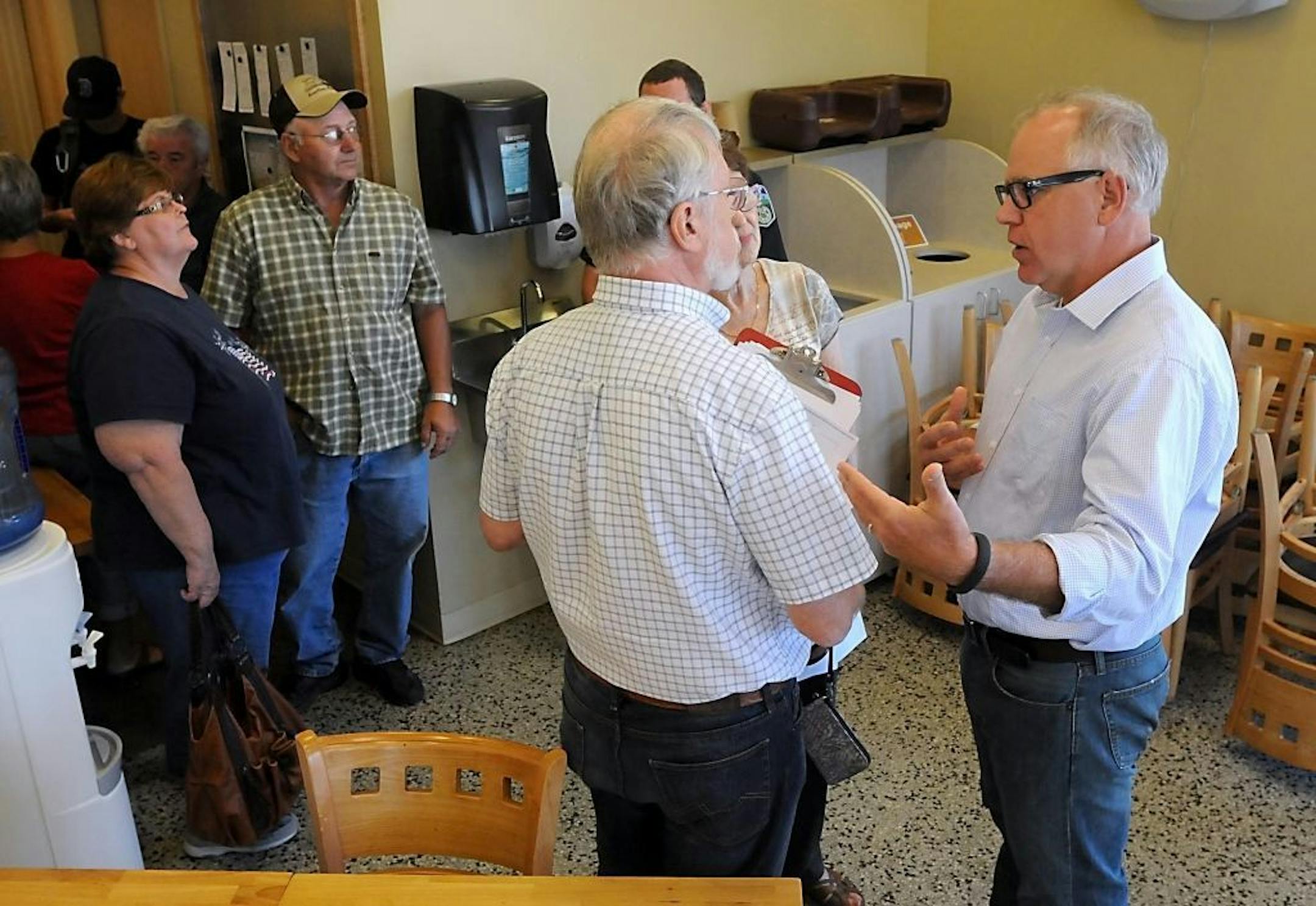Congressman Tim Walz, right, D-Minn., talks with a couple during a listening session on the situation in Syria, Friday, Sept. 6, 2013, in St. Peter, Minn. Walz met one-on-one with more than 100 constituents at the St. Peter Food Co-op.