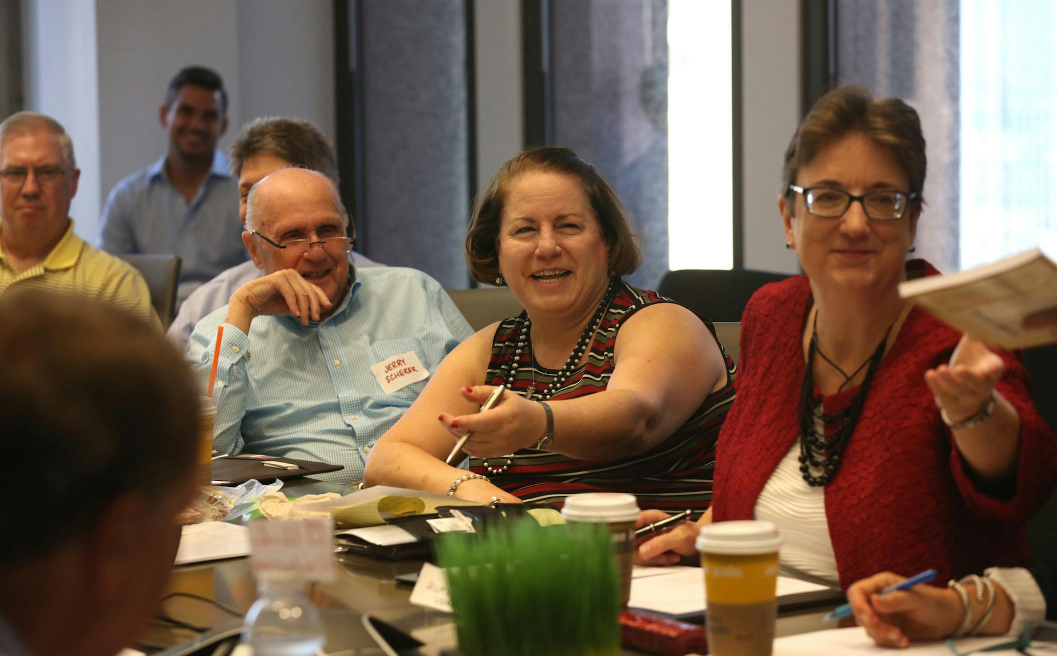 Lise Rosengard, center, discusses strategies for talking with recruiters on Aug. 10, 2016, at a meeting of the Financial Executives Networking Group in the downtown Chicago office of Addison Group, a professional staffing and job search firm. (Nancy Stone/Chicago Tribune/TNS)