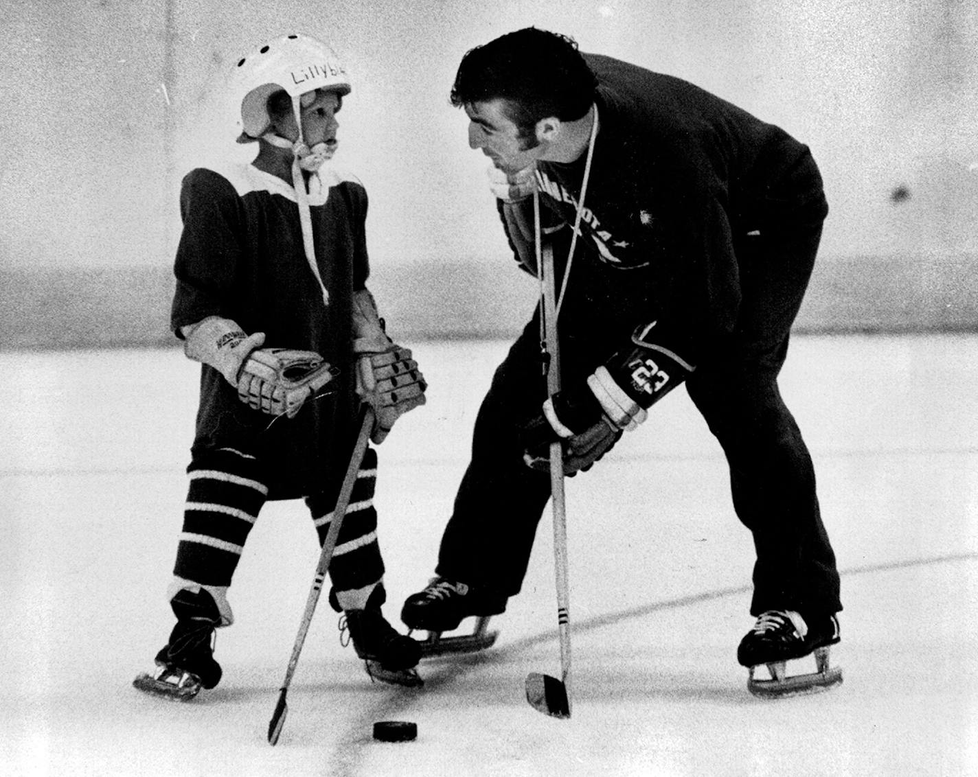 In 1971, Parise gave advice to 5-year-old Mike Lilyblad of Rice Lake, Wis., during a hockey clinic at Met Center.