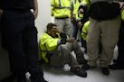Rescue team member Jonathan Cruz cries on the floor as he waits to assist in the aftermath of Hurricane Maria in Humacao, Puerto Rico, Wednesday, Sept