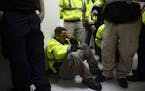 Rescue team member Jonathan Cruz cries on the floor as he waits to assist in the aftermath of Hurricane Maria in Humacao, Puerto Rico, Wednesday, Sept