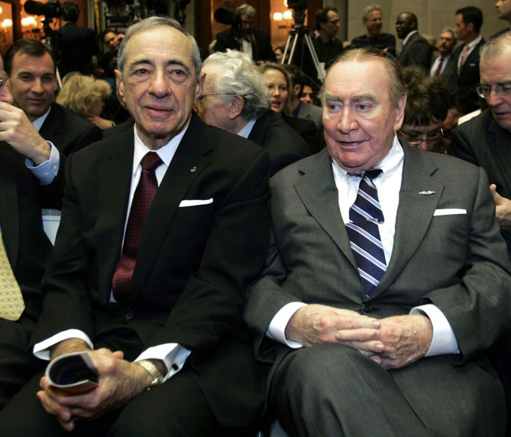 In this Jan. 7, 2009 photo, former New York Govs. Mario Cuomo, left, and Hugh Carey are seen at the Capitol in Albany, N.Y. Carey, who led the rescue effort that brought New York City back from the brink of bankruptcy during its 1975 fiscal crisis, died Sunday, Aug. 7, 2011. He was 92.