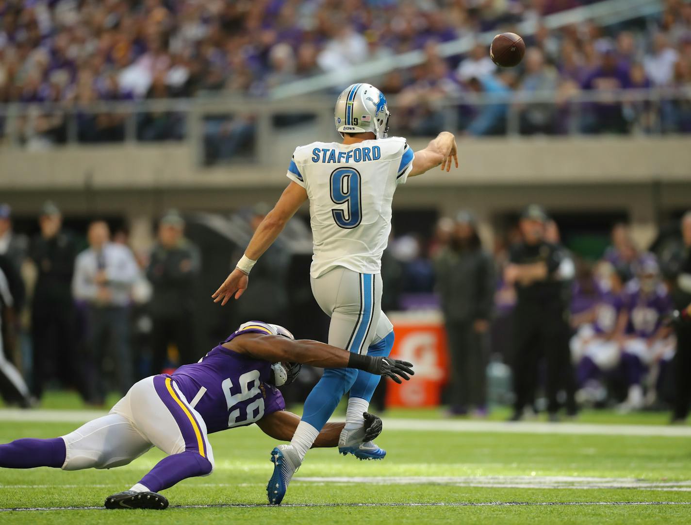 Lions quarterback Matthew Stafford threw an interception while pressured by Vikings defensive end Danielle Hunter on Nov. 6 at U.S. Bank Stadium.