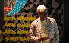 Houston White Jr. delivers a speech about hope and promise and the Camden neighborhood to a group of friends and neighbors crammed into his Get Down C