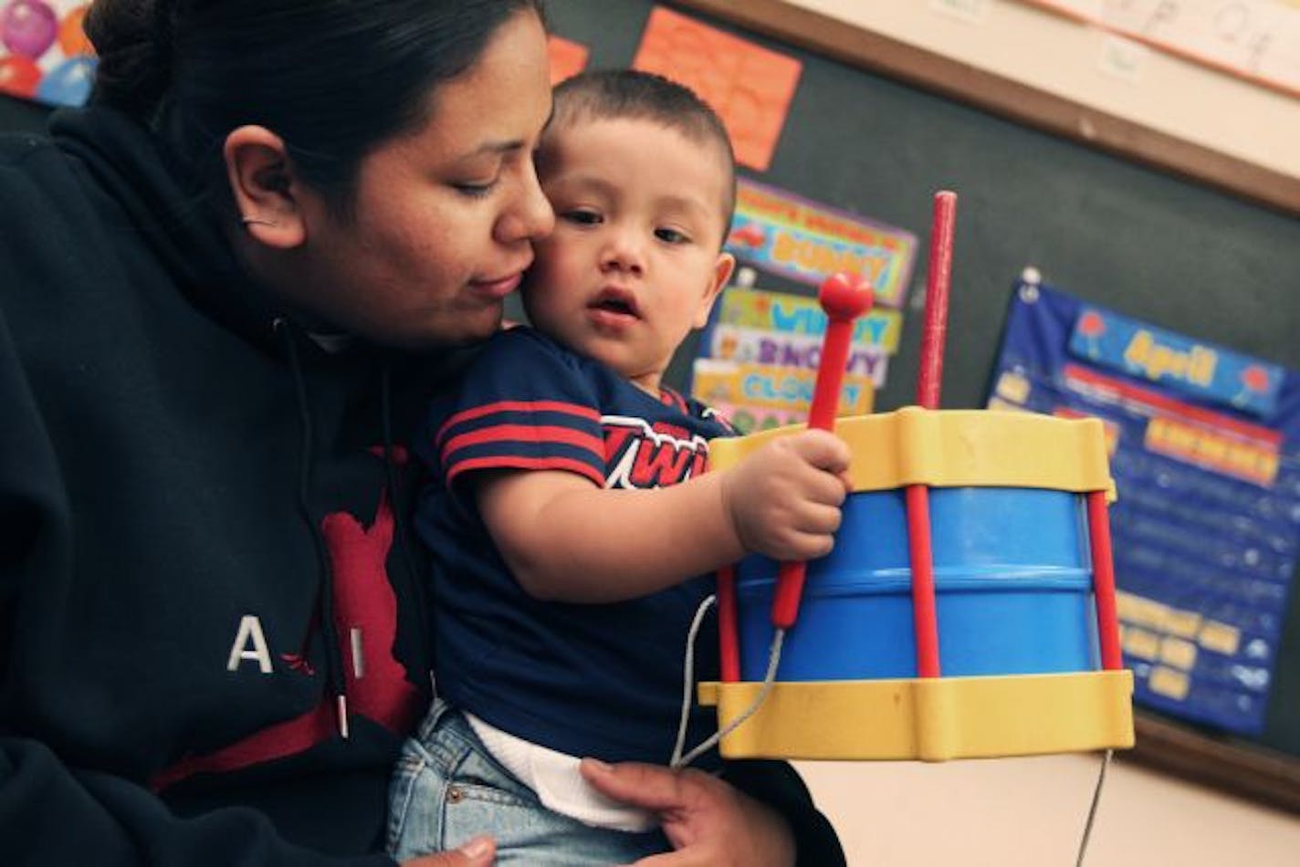 Jenni Bruce, 20, is the parent of a 16 month old , Lewis Ortley, who is a toddler at the Neighborhood Early Learning Center. Her son is learning to play the drums from his uncle. Lewis should be able to play his own drum song at a pow wow when he is three years old.