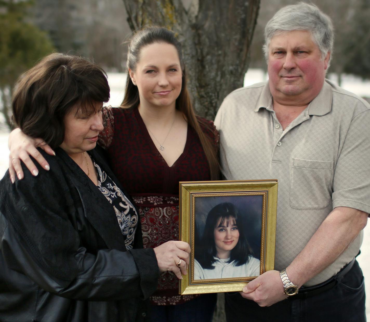 Jim Stuedemann with his wife and daughter near Jolene's grave.