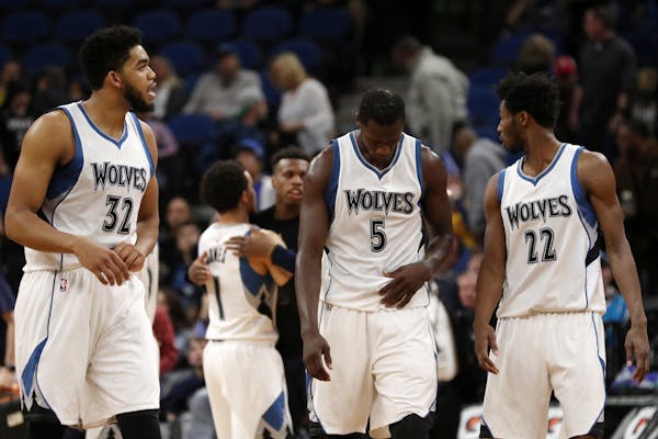 Minnesota Timberwolves players including center Karl-Anthony Towns (32), forward Gorgui Dieng (5), and forward Andrew Wiggins (22) leave the court aft