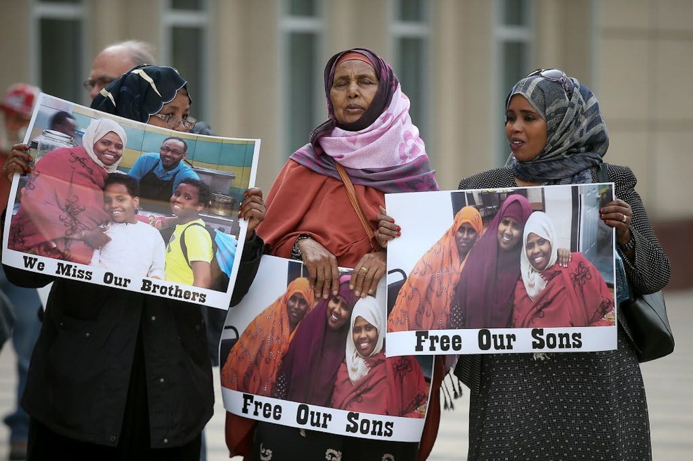 Supporters and family members of young Somali men standing trial, stood for a small protest before the opening day of the ISIL recruit trial, in front of the United States Courthouse, Monday, May 9, 2016 in Minneapolis, MN.