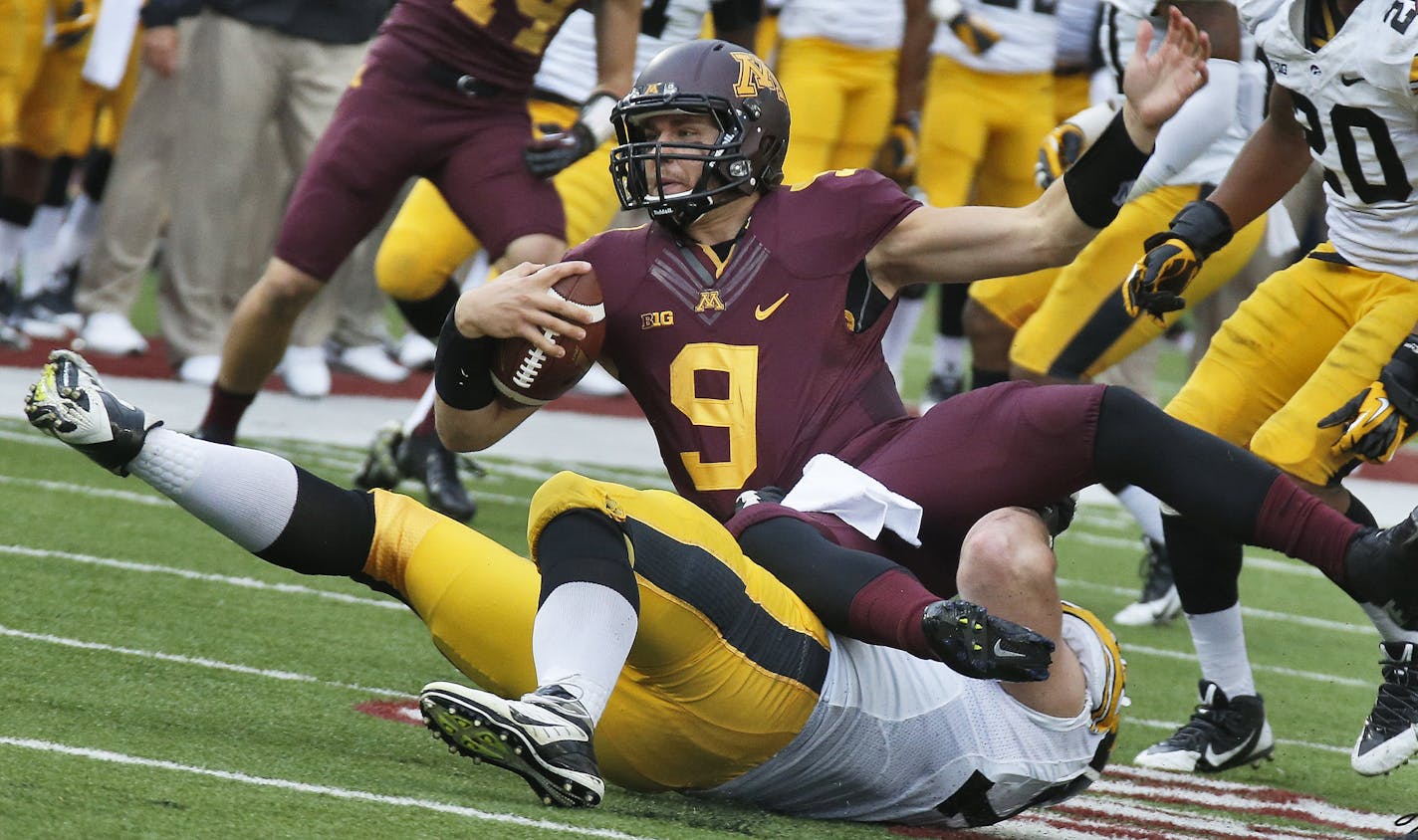 Iowa Hawkeyes va. Minnesota Gophers football. Iowa won 23-7. Minnesota quarterback Philip Nelson was sacked by Iowa defenders in 2nd half action. (MARLIN LEVISON/STARTRIBUNE(mlevison@startribune.com)