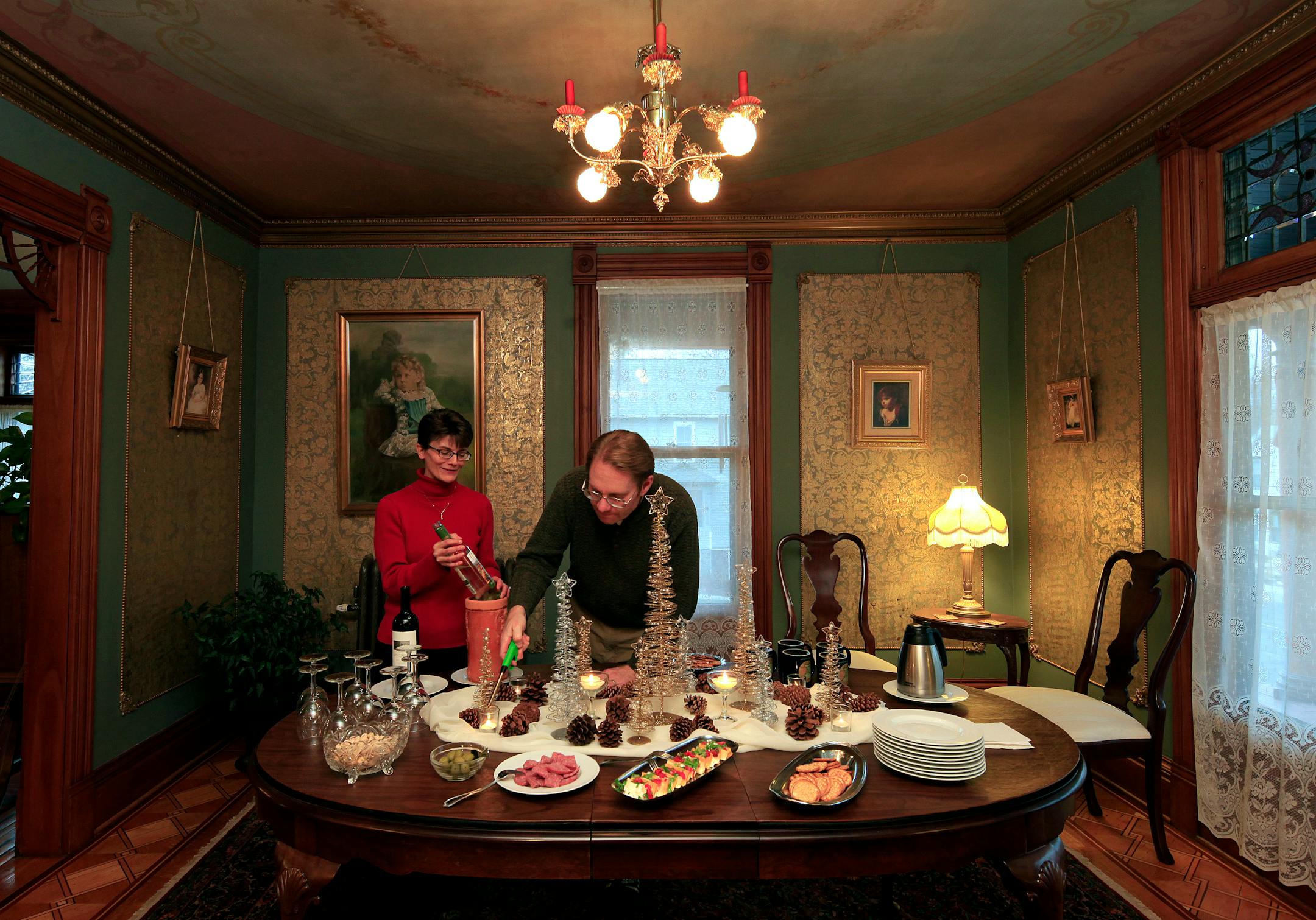 Sandy and Tom Lyman offer guests a social hour in the parlor of their 1880s B&B.