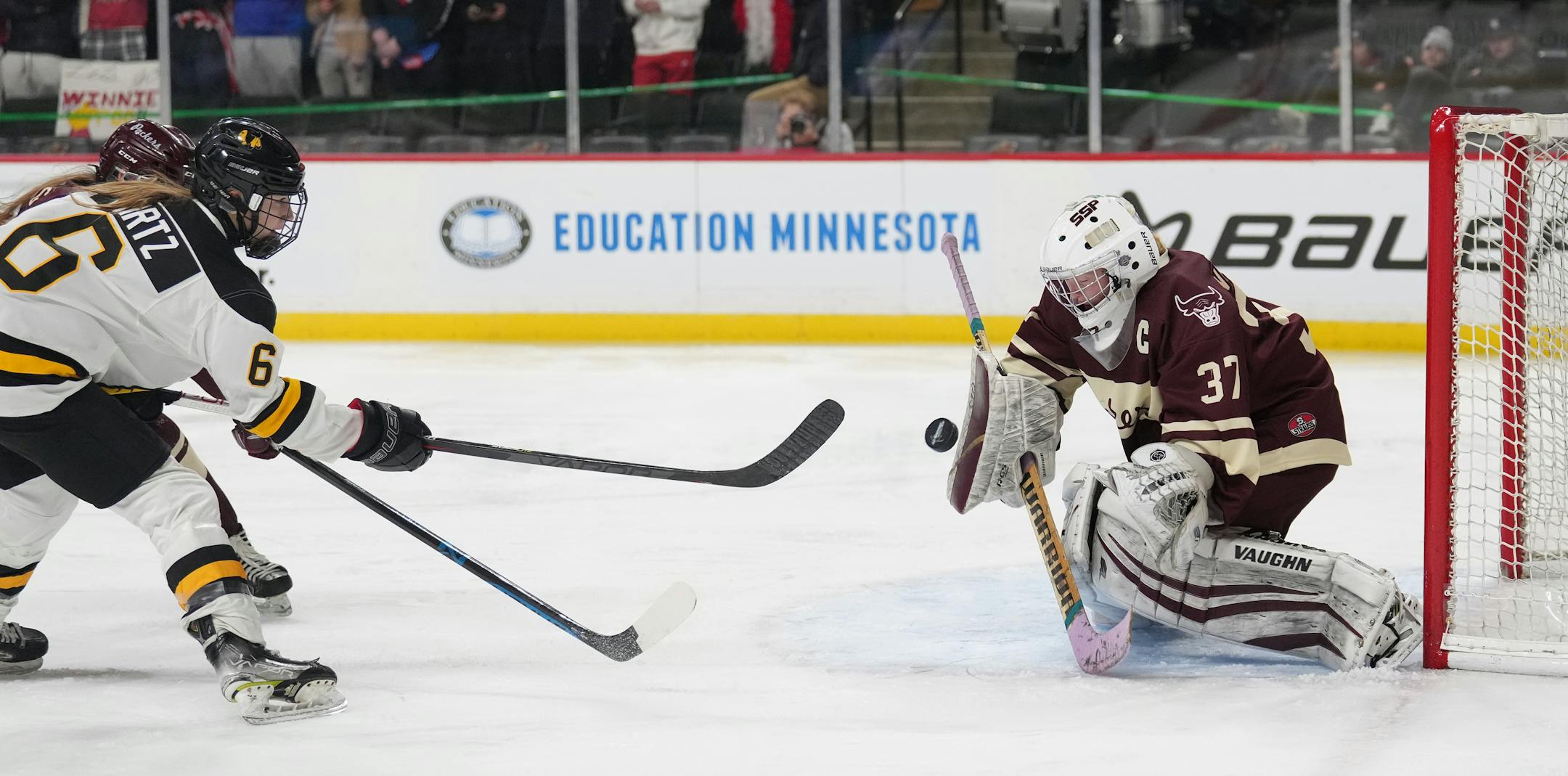 Warroad forward Rylee Bartz (6) gets a shot off against South St. Paul goaltender Delaney Norman (37) in the first period.