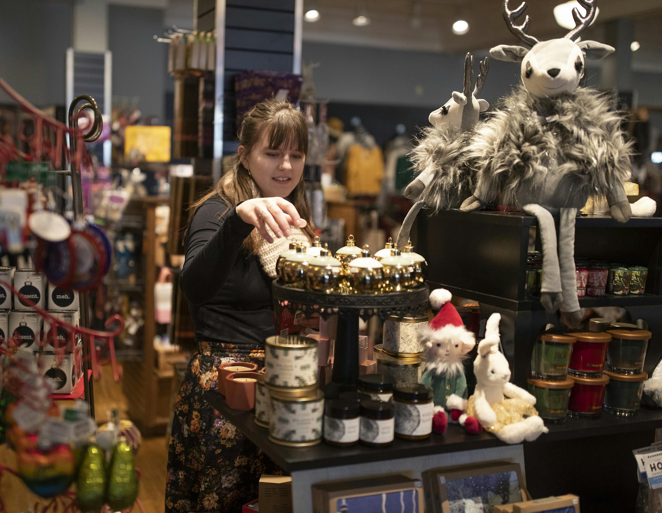 Chelsea O'Brien gift department manger at the Electric Fetus arranged Christmas items at the store. ] Jerry Holt • Jerry.Holt@startribune.com Story on retail holiday hiring, in one of the tightest labor markets in a generation. More retailers, including small independents such as Electric Fetus, keeps a reserve of former employees who come back to help out during the busy holidays Thursday November 15, 2019 in Minneapolis, MN.