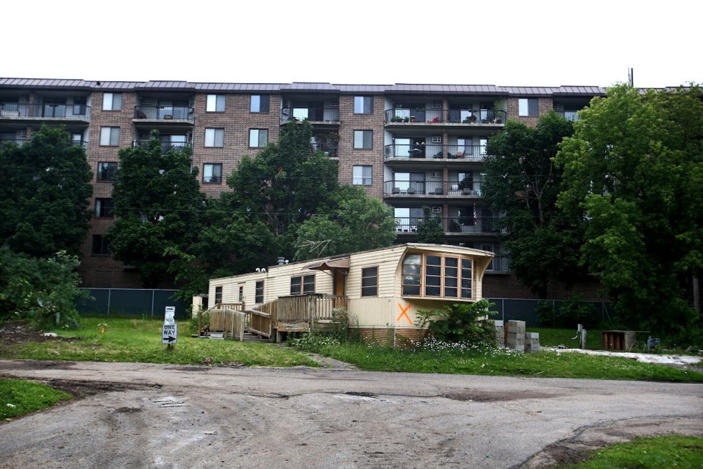 Lowry Grove, a manufactured home park in St. Anthony, is closing for good later today after 70 years of operation in favor of more modern redevelopment. Here, one of the remaining homes is marked with an X for demolition, sitting next to an apartment complex Thursday, June 29, 2017, in St. Anthony.] DAVID JOLES &#xef; david.joles@startribune.com Lowry Grove, a mobile home park in St. Anthony, is closing for good later today after 70 years of operation.