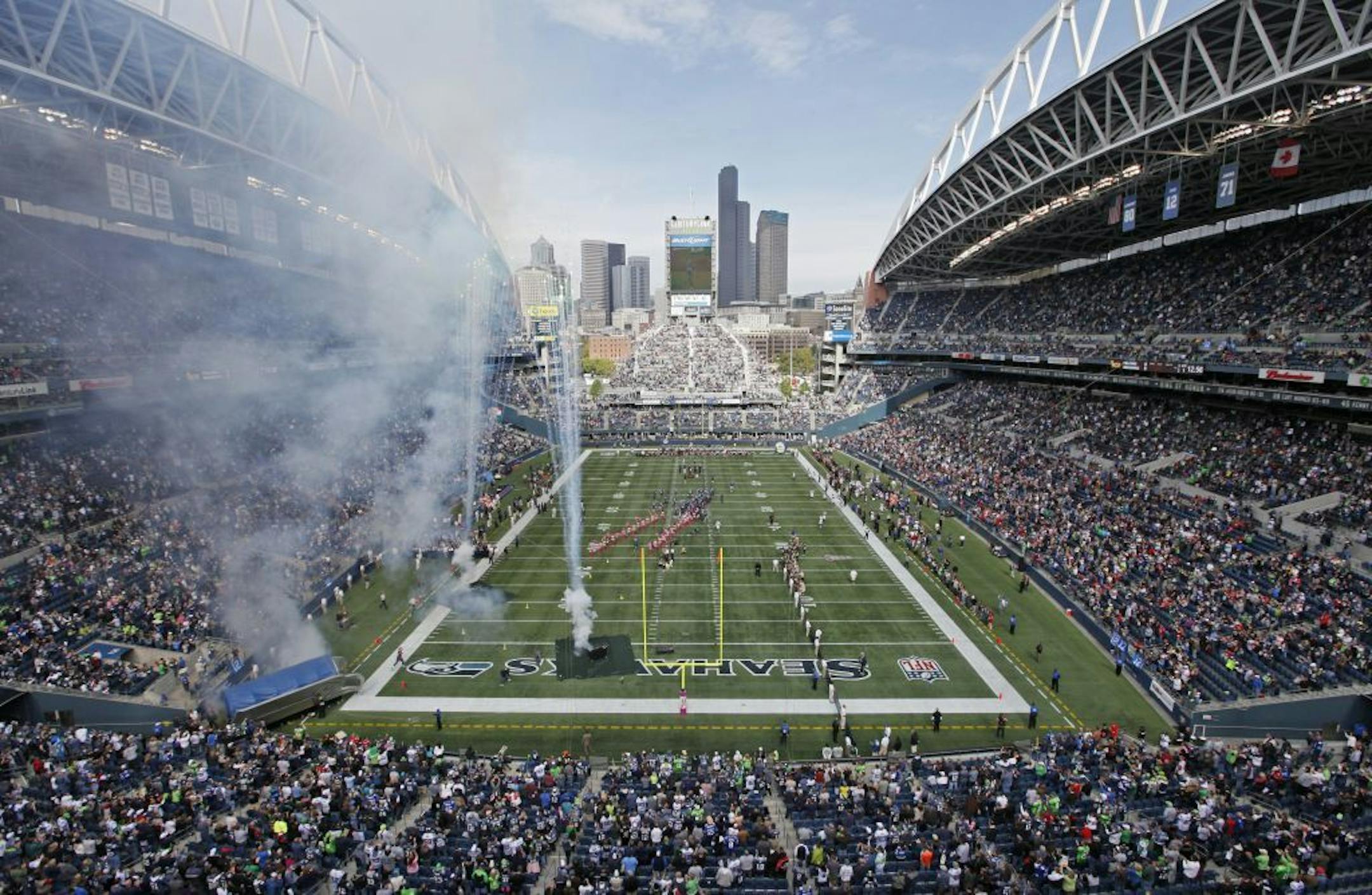 The Seahawks and Falcons take the field at CenturyLink Field before an NFL game last season.