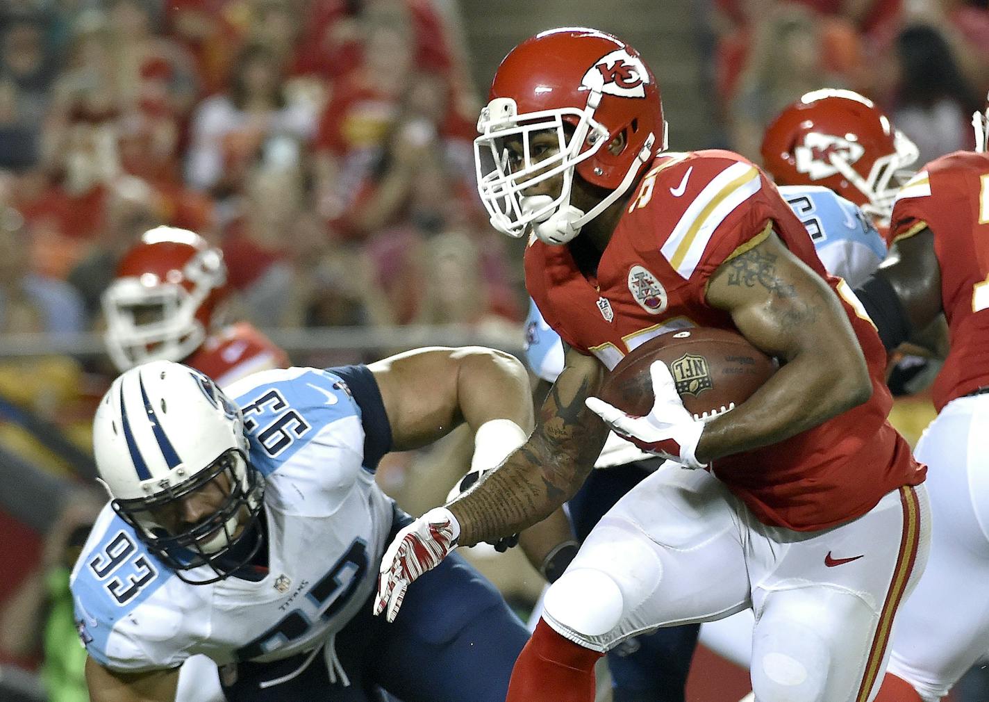 Kansas City Chiefs running back Charcandrick West (35) runs around end in the third quarter against the Tennessee Titans at Arrowhead Stadium in Kansas City, Mo., on Friday, Aug. 28, 2015. The Chiefs won, 34-10. (John Sleezer/Kansas City Star/TNS) ORG XMIT: 1173031