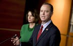 Rep. Adam Schiff, D-Calif., Chairman of the House Intelligence Committee, right, accompanied by House Speaker Nancy Pelosi of Calif., left, speaks abo