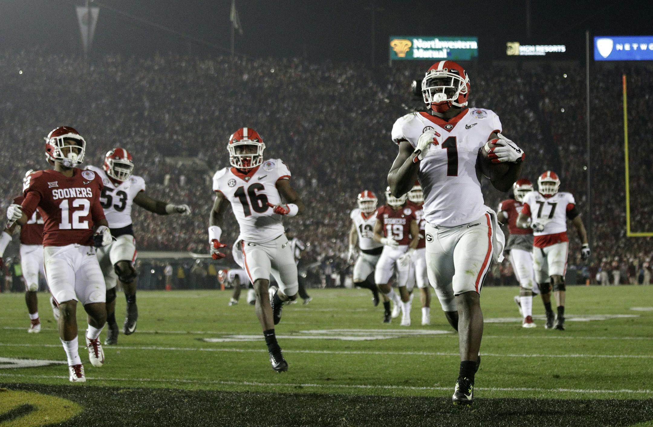 Georgia running back Sony Michel (1) scores a touchdown in overtime against Oklahoma in the Rose Bowl NCAA college football game, Monday, Jan. 1, 2018, in Pasadena, Calif. Georgia won 54-48. (AP Photo/Jae C. Hong)