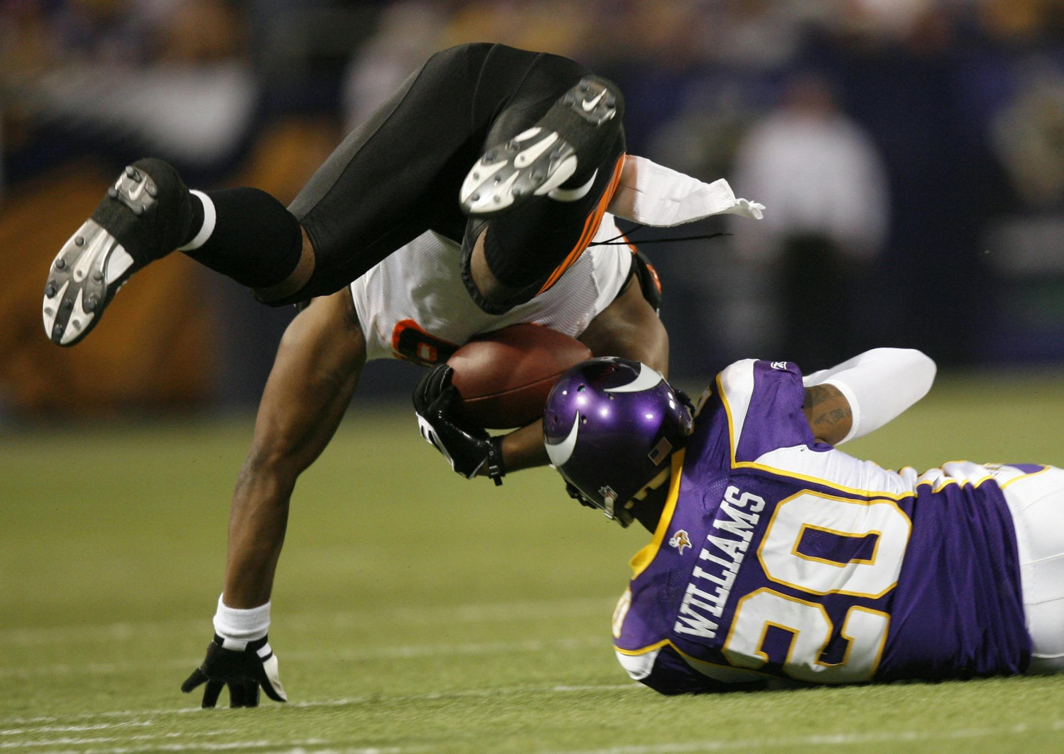 Vikings defender Madieu Williams tripped up Daniel Coats.