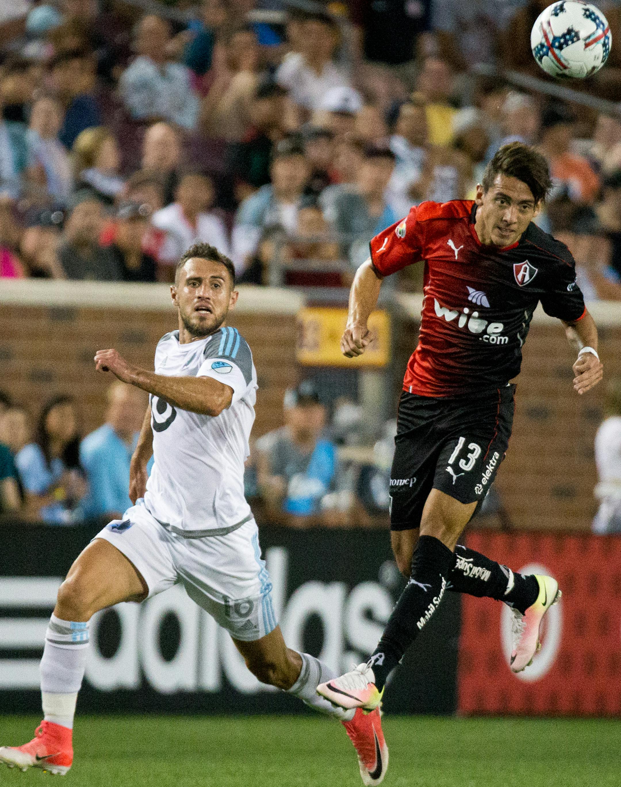 Atlas&#x2019; Javier Salas heads the ball while Minnesota United&#x2019;s Bashkim Kadrii watches during the second half on Saturday, July 15, 2017, at TCF Bank Stadium. ] COURTNEY PEDROZA &#x2022; courtney.pedroza@startribune.com July 15, 2017; Minnesota United vs. Atlas; TCF Bank Stadium; Minneapolis, MN.
