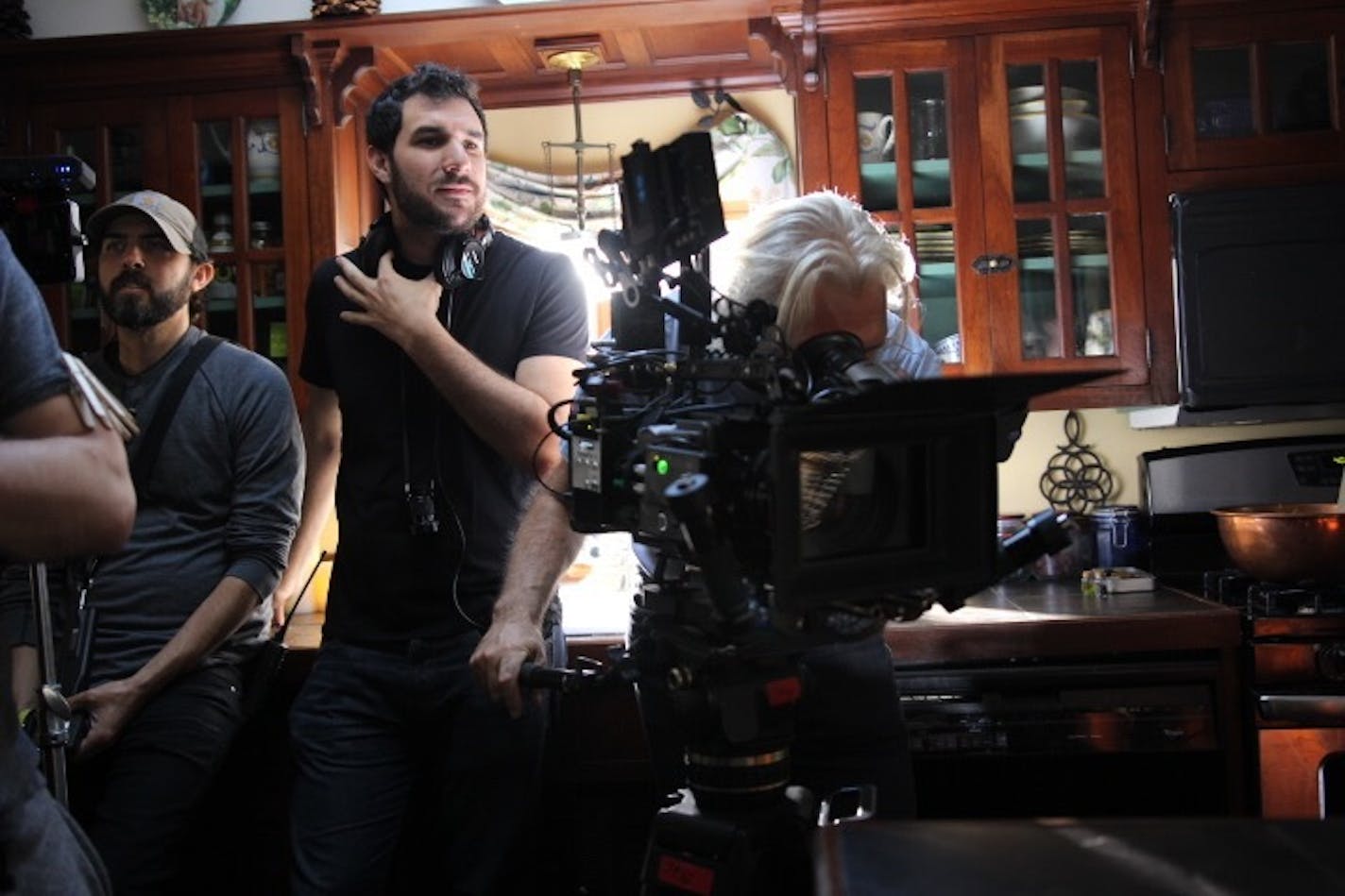 Director Joel Novoa (second from left) supervised a scene in "The Nanny."