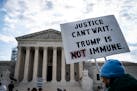 Protesters demonstrating against the argument that former President Donald Trump has “absolute immunity” outside the Supreme Court in Washington, 