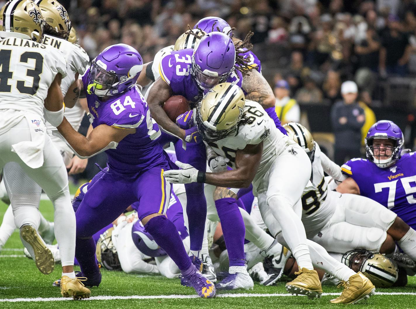 Vikings running back Dalvin Cook (33) had 31 touches against the Saints on Sunday, including this 1-yard touchdown run over New Orleans outside linebacker Demario Davis (56) in the third quarter.