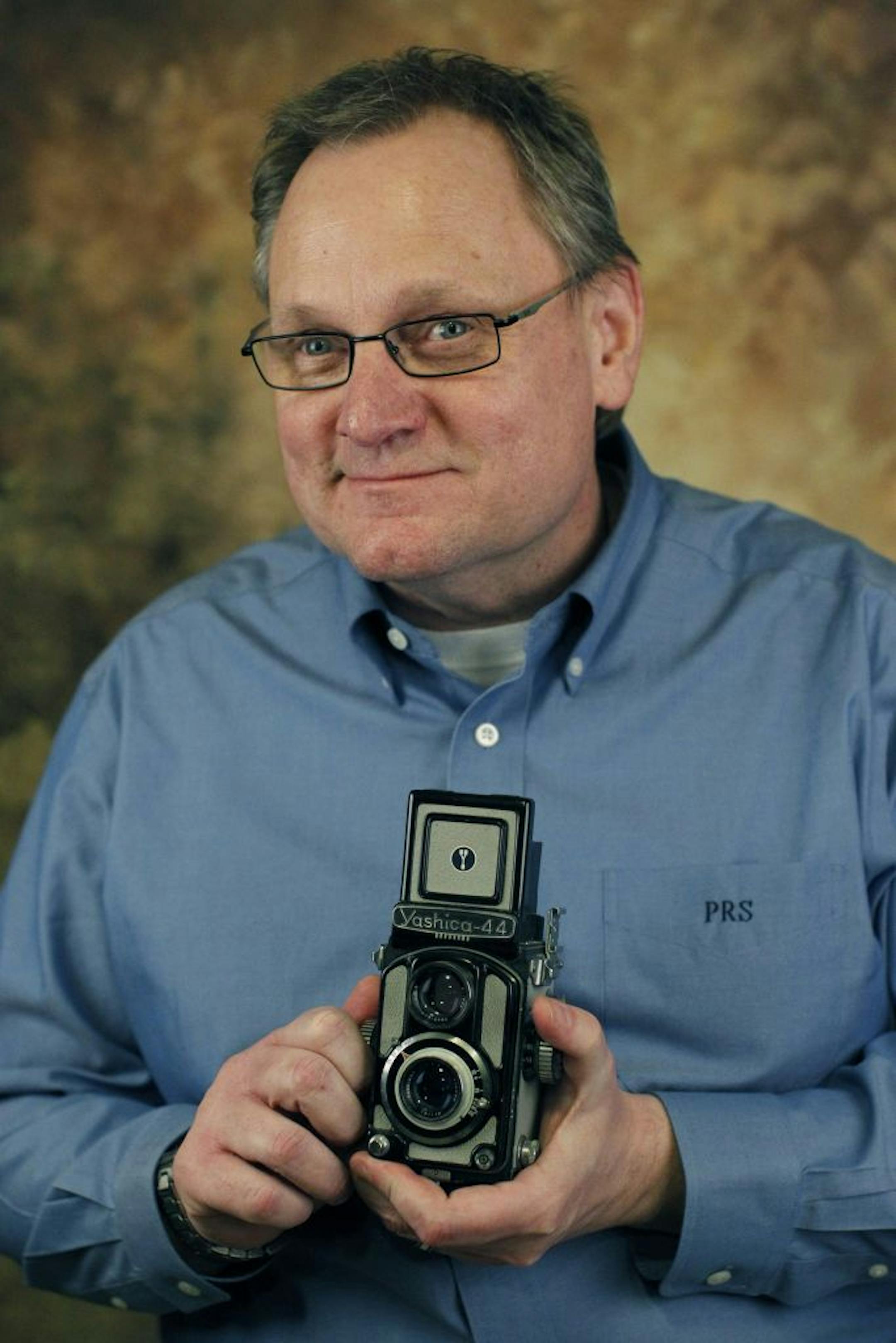 At his home in Ramsey, Anoka County Sheriff's Commander Paul Sommer has many antique cameras including this Yashica medium format camera from the 1960's. He's an amateur photographer. Many of the cameras would be worthless to collectors, even if they worked.