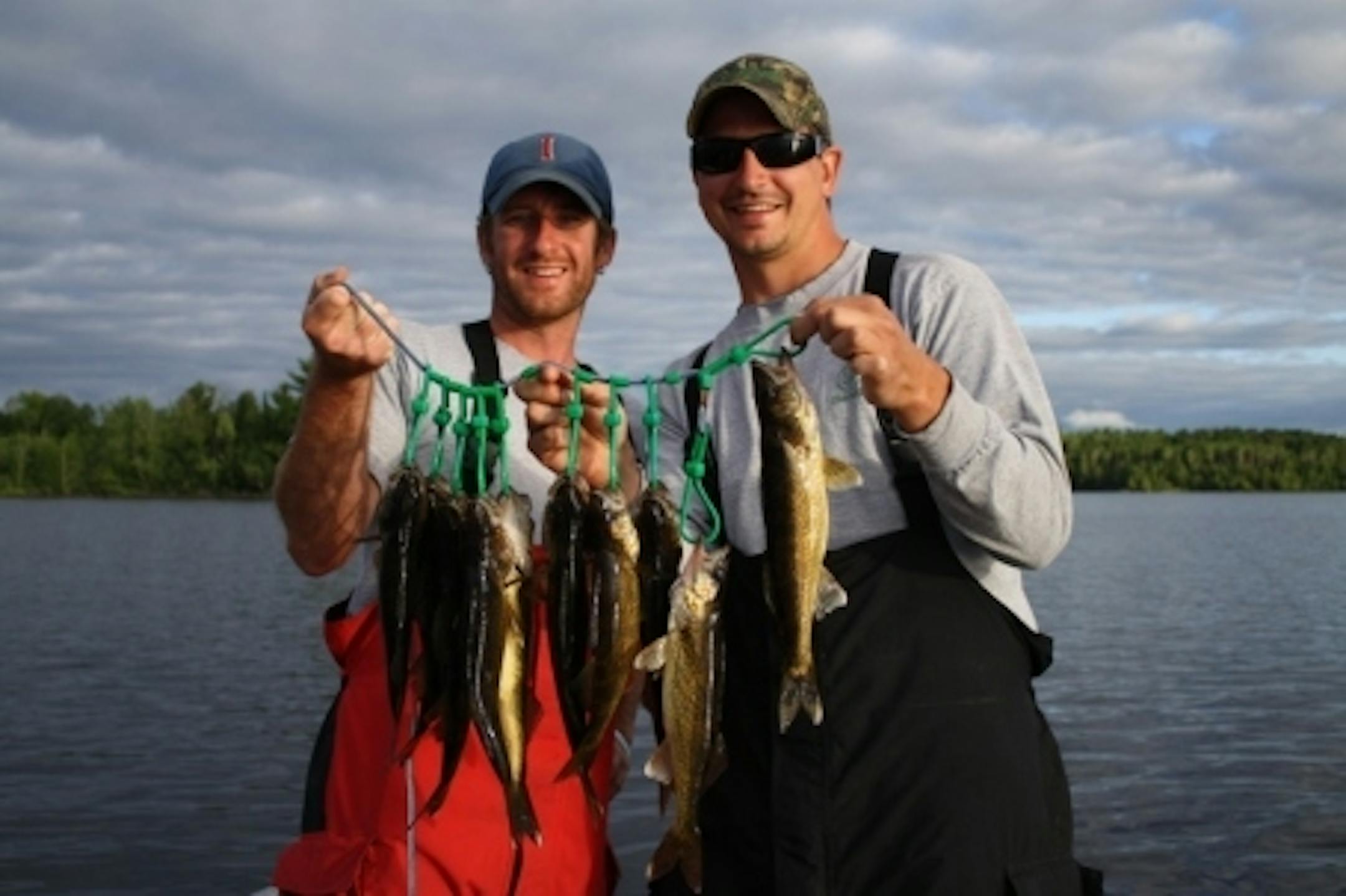Sean Bailey and Matt Hennen hoist a fresh meal of walleyes during the 2010 trip to the Boundary Waters Canoe Area.
